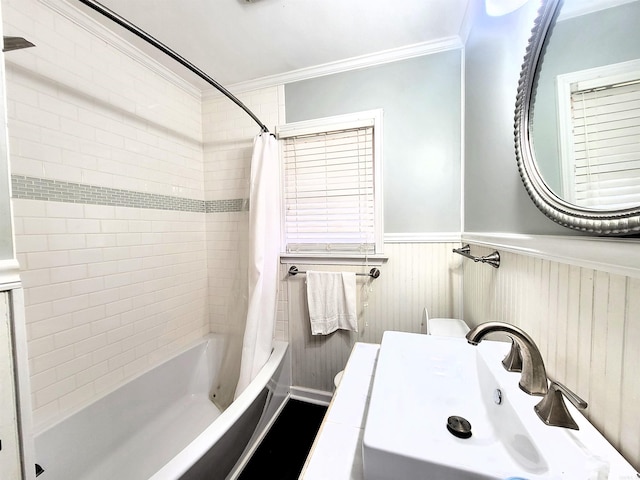 full bathroom featuring shower / bath combination with curtain, toilet, ornamental molding, and sink