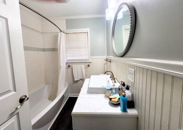 bathroom featuring shower / bath combination with curtain, ornamental molding, and vanity