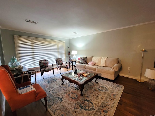 living room with dark hardwood / wood-style floors and crown molding