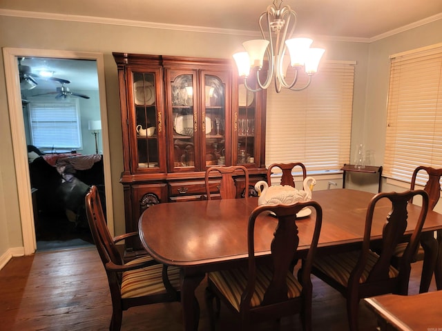 810 Hudson, Pine Bluff, AR 71603 - dining area with dark wood-style flooring, crown molding, and a chandelier