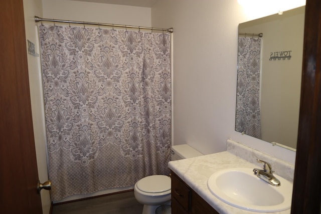 full bathroom with hardwood / wood-style flooring, vanity, toilet, and shower / bathtub combination with curtain