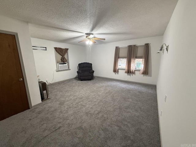 unfurnished room featuring carpet flooring, a textured ceiling, ceiling fan, and cooling unit