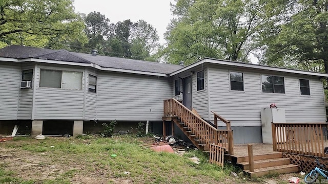 back of house featuring a wooden deck