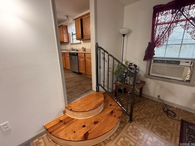 stairs featuring hardwood / wood-style floors and cooling unit