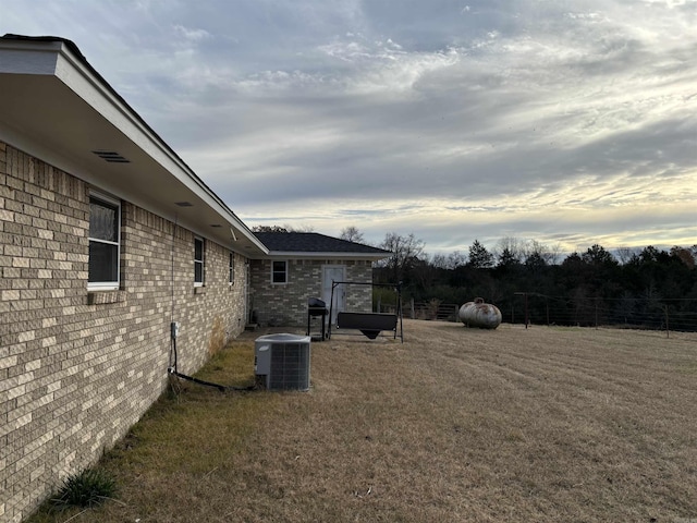 view of yard with central AC unit