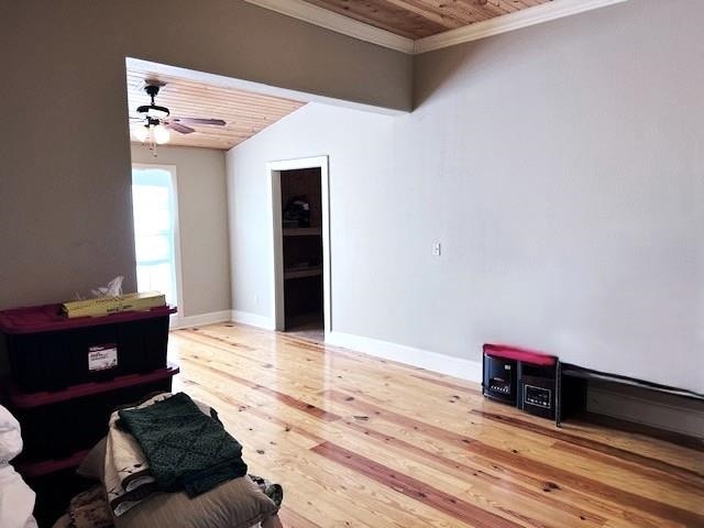 living area with ceiling fan, wood-type flooring, lofted ceiling, wood ceiling, and ornamental molding