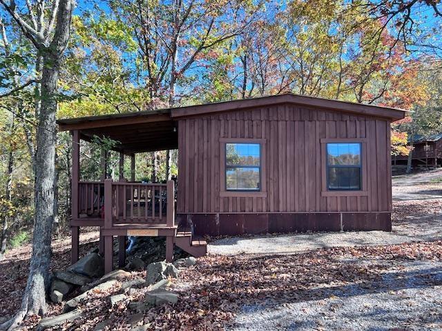 view of outbuilding with a carport