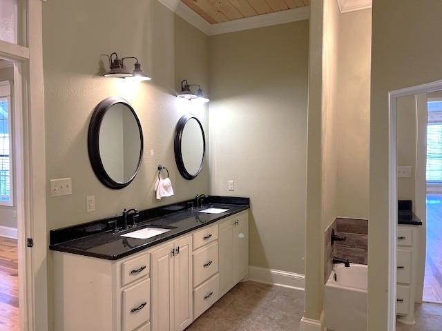 bathroom with a bath, crown molding, wood-type flooring, vanity, and wood ceiling