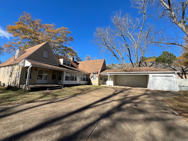 view of front of house featuring covered porch and a garage