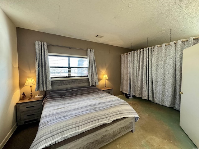 bedroom featuring a textured ceiling