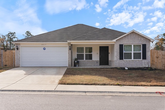 ranch-style house featuring a front lawn and a garage