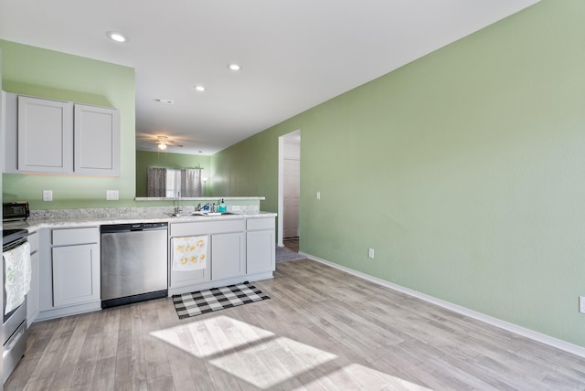 kitchen with light wood-type flooring, sink, and appliances with stainless steel finishes