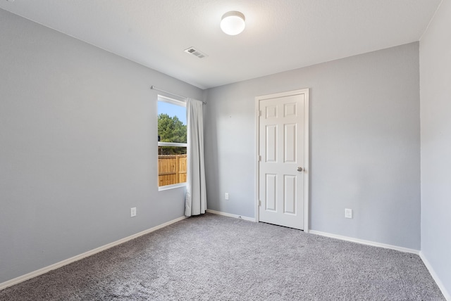 spare room featuring carpet