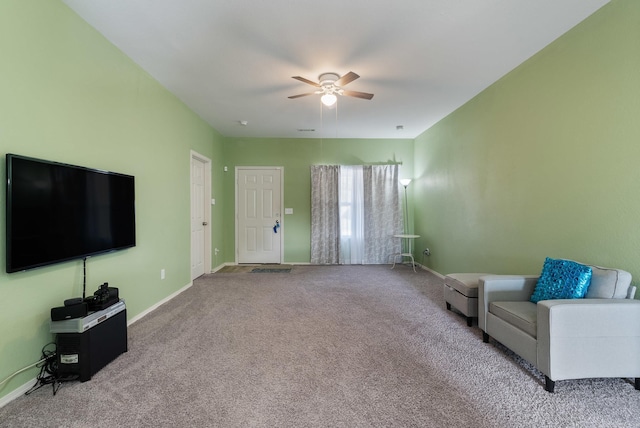 carpeted living room with ceiling fan