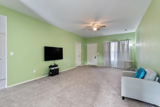 unfurnished living room with carpet flooring and ceiling fan