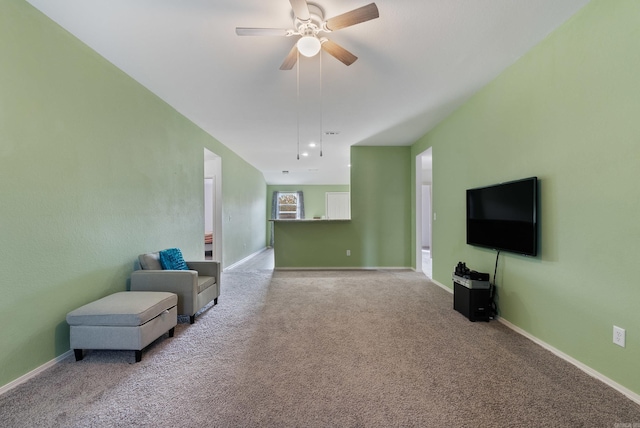 sitting room with light carpet and ceiling fan