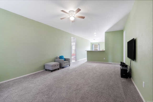 unfurnished living room featuring carpet floors and ceiling fan