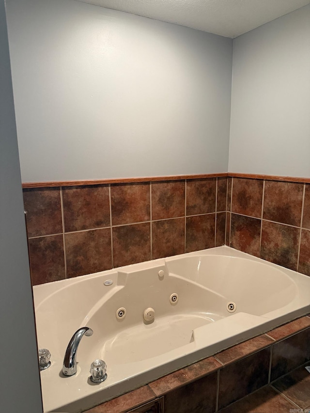 bathroom featuring tiled bath