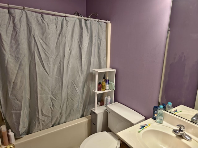 full bathroom featuring vanity, toilet, and shower / bathtub combination with curtain