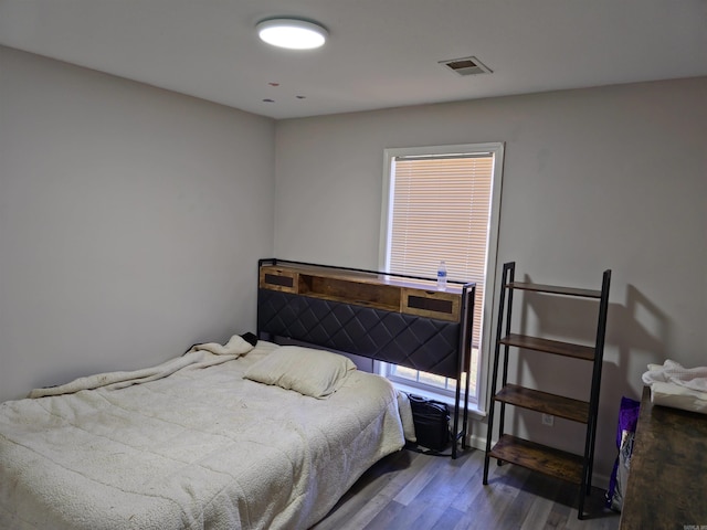 bedroom featuring dark wood-type flooring