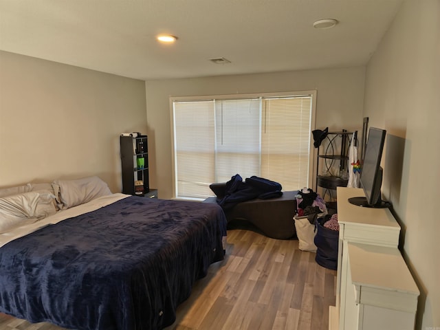 bedroom with light wood-type flooring