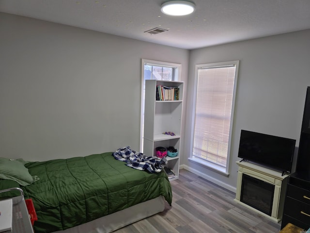 bedroom featuring wood-type flooring