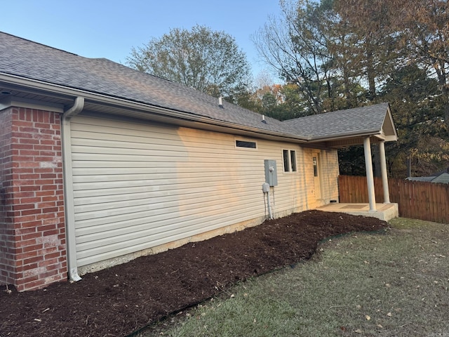 view of home's exterior with a yard