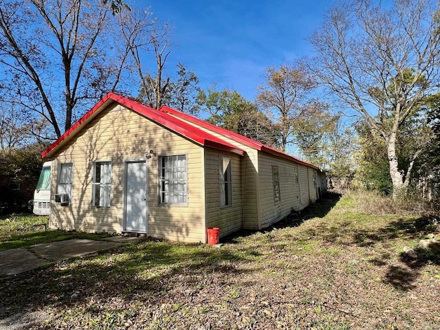 view of home's exterior with cooling unit