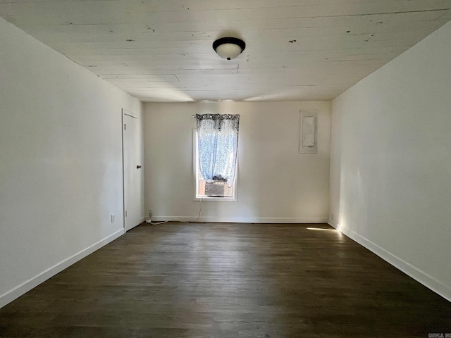 spare room with dark hardwood / wood-style flooring and cooling unit