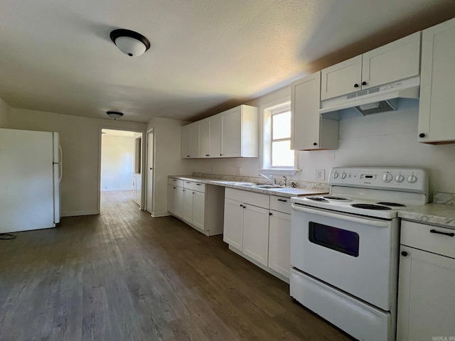 kitchen with white appliances, dark wood-type flooring, white cabinets, sink, and a textured ceiling