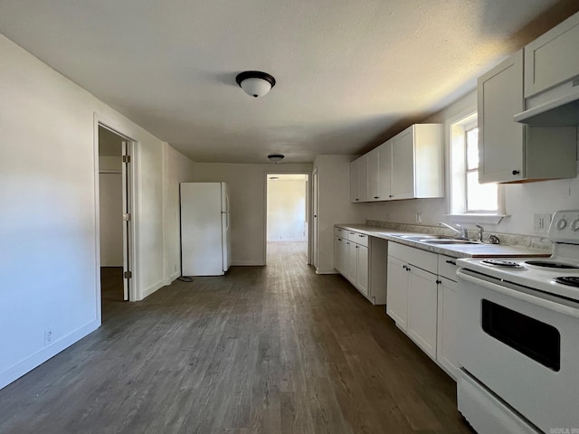 kitchen featuring dark hardwood / wood-style floors, white cabinetry, white appliances, and sink