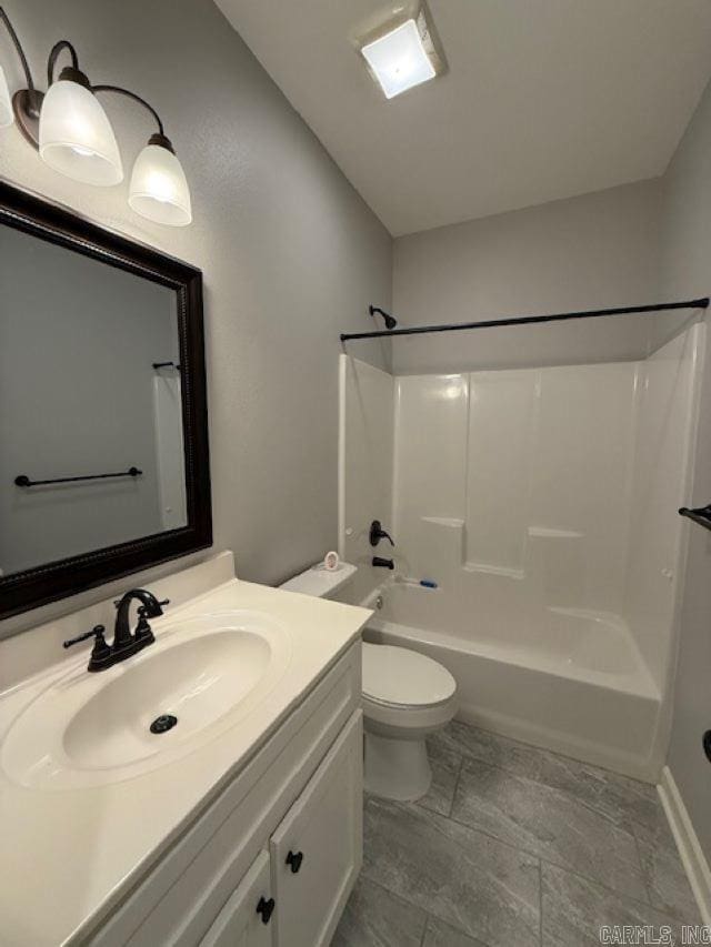 full bathroom with vanity, bathtub / shower combination, and toilet