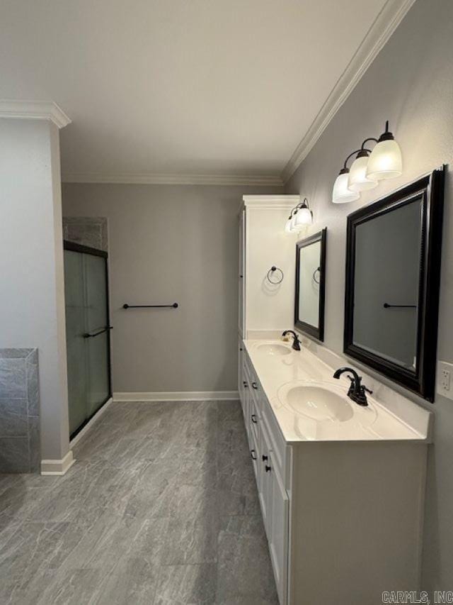 bathroom featuring crown molding, vanity, and a shower with shower door