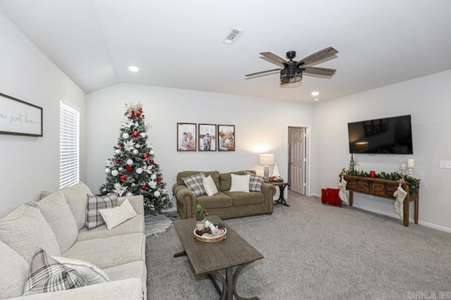 carpeted living room featuring ceiling fan and lofted ceiling