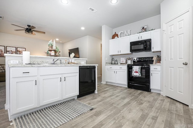 kitchen with black appliances, ceiling fan, light stone countertops, light hardwood / wood-style floors, and white cabinetry