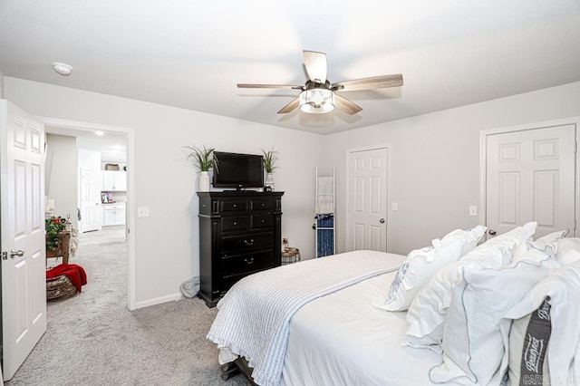 bedroom with ceiling fan and light colored carpet