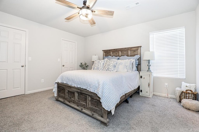 bedroom with light carpet and ceiling fan