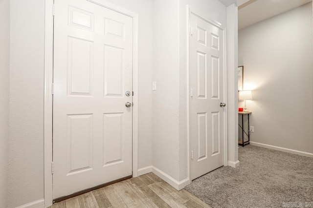 hallway with light wood-type flooring