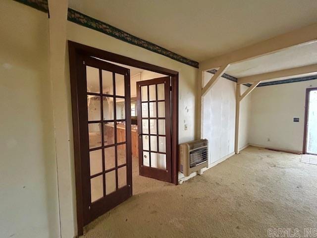 interior space with french doors and heating unit