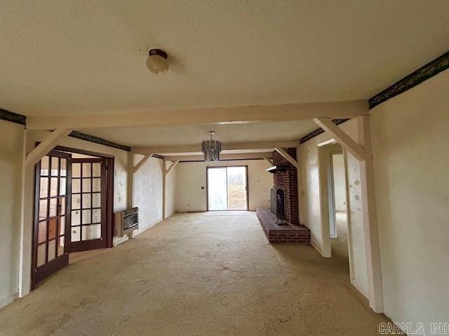 unfurnished living room with heating unit, light colored carpet, and a brick fireplace