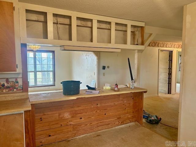 kitchen featuring a textured ceiling