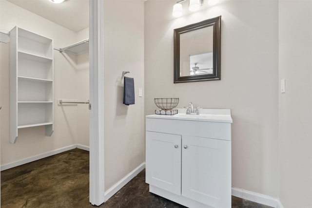 bathroom featuring vanity, concrete floors, and ceiling fan