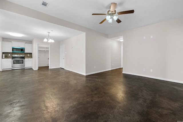 unfurnished living room with ceiling fan with notable chandelier