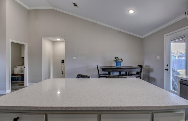 kitchen with crown molding and vaulted ceiling