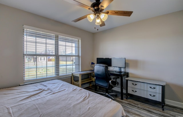 bedroom featuring ceiling fan and dark hardwood / wood-style floors