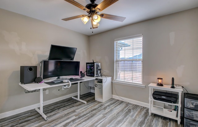 office with hardwood / wood-style floors and ceiling fan