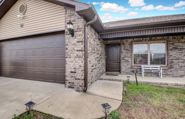 entrance to property featuring a garage