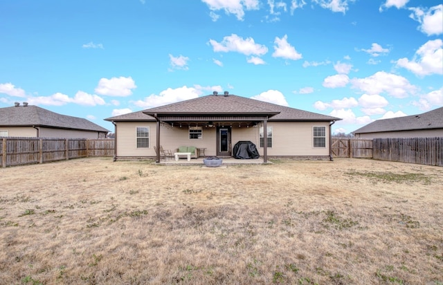 rear view of house with a yard, a patio, and an outdoor hangout area