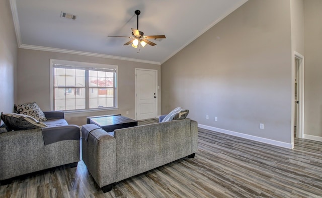 living room with hardwood / wood-style floors, ceiling fan, ornamental molding, and vaulted ceiling