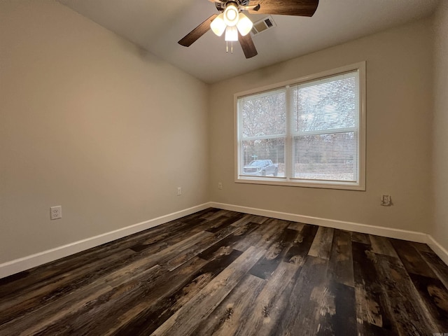 empty room with ceiling fan and dark wood-type flooring